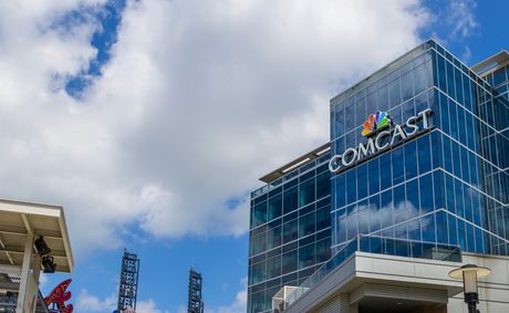 Comcast split sends its shares to 17-year highs