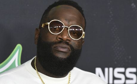 Rick Ross caught on commercial flight and Drake fans erupt