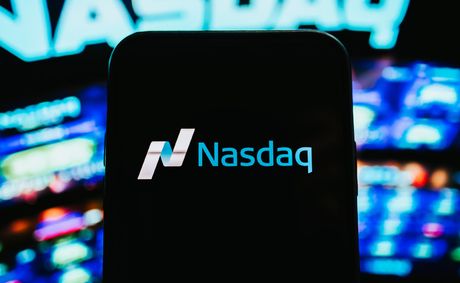 Dow surges to record while Nasdaq falls on Apple drop