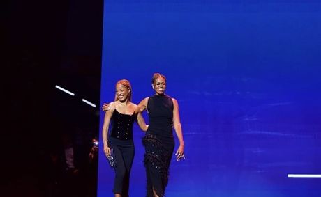 Michelle Obama Stuns At Essence Fest In A Bold Black Gown Featuring Eyelet Details And A Dramatic Thigh-High Slit