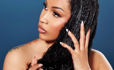 Cardi B Turns Nostalgia Into A Brand Experience, Recreating Her Grandmother’s Living Room for Grow-Good At Essence Fest